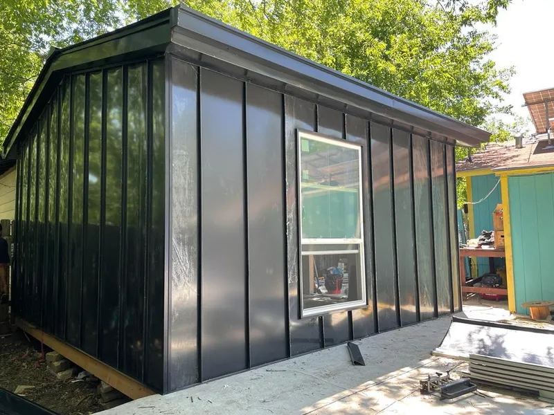 Black standing seam metal wall panels for Metal Roof Installation in Oswego